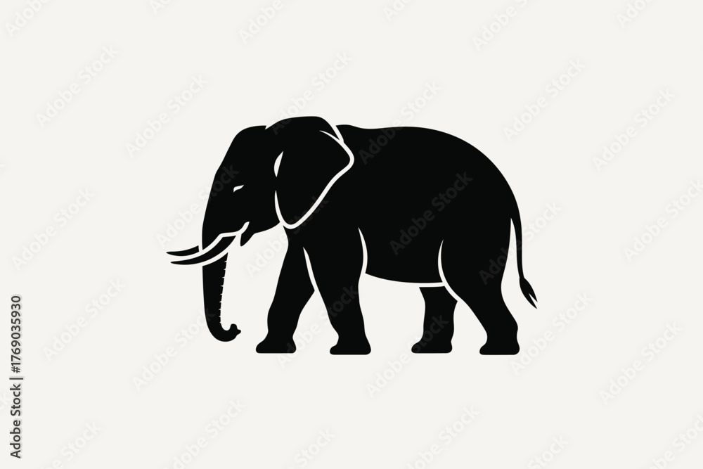 Fototapeta premium Black silhouette of a majestic elephant walking against a light background
