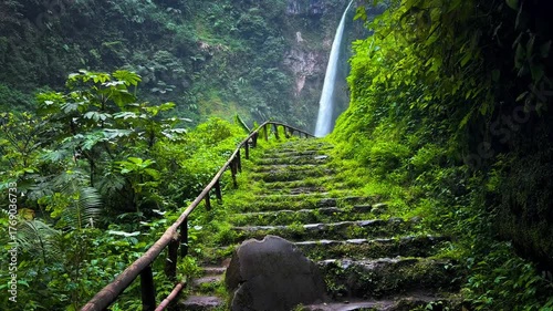 cascading waters of Sekumpul Waterfall, surrounded by lush green jungle in near Bromo in Malang, East Java, Indonesia. Ideal for nature, travel, and tropical adventure themes
