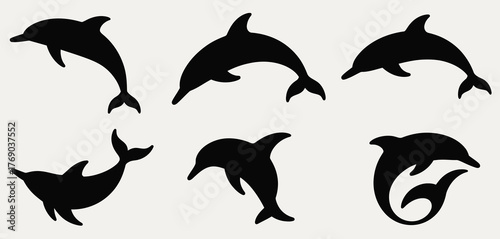 Collection of silhouetted dolphins in various playful poses