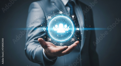 Businessman holding virtual human resources management system in his hand