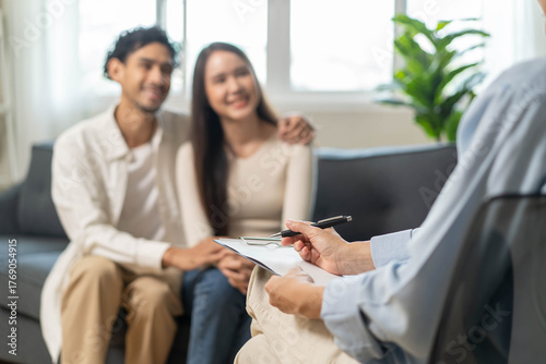 Spouses relationship consultant concept, Married couple listen to psychologist  during therapy talk session for married couple that mental health breakdown and relationship problems.