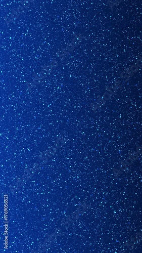 Blue Stardust on a Dark blue background. Vertical video for social media background.