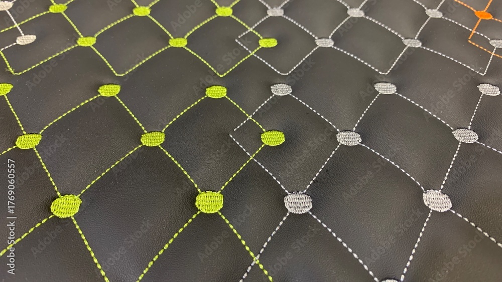 Obraz premium Modern quilted pattern with vibrant green and gray stitching on black synthetic leather for stylish backgrounds