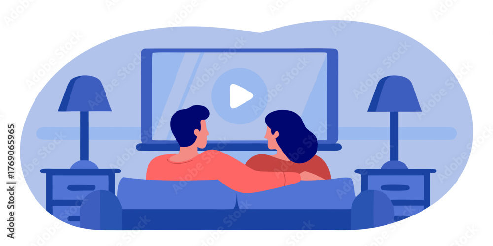 Obraz premium Couple watching a movie together on a couch in a cozy living room - Concept of Black Friday