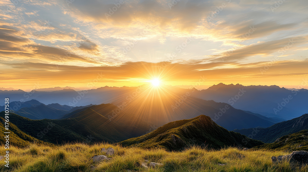 Fototapeta premium Majestic mountain range under golden sky at sunset, creating cinematic sense of scale and beauty