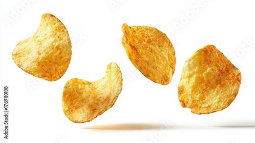 Delicious potato chips levitating in the center of the image with a white background and their shadow underneath, advertising concept, image with copyspace, typical US potatoes, golden potato color 