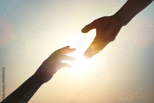 The concept of a helping hand, a helping hand and a helped hand, cooperation, collaboration, teamwork, harmony, cooperation, and volunteer work.
