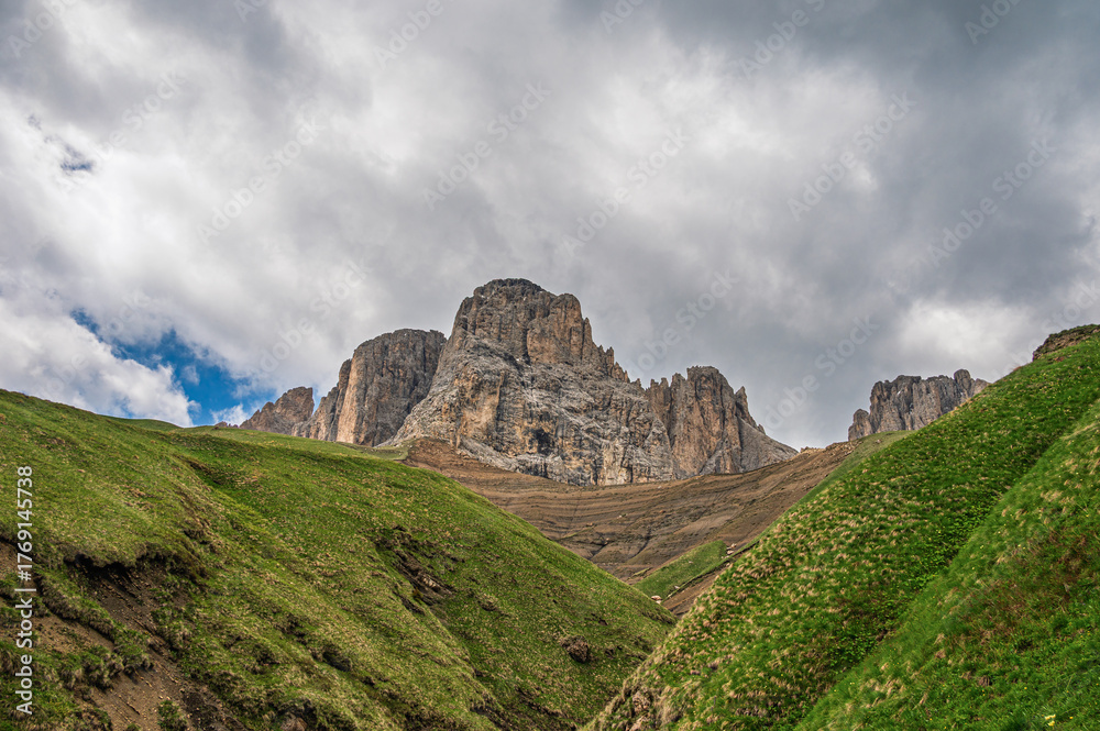 Obraz premium Sasso Lungo mountain range images with a cloudy sky in the background, Val di fassa, Dolomites, Italy