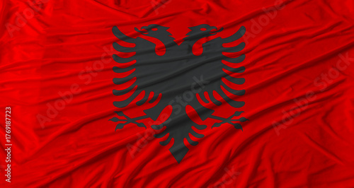 Foto Albanian flag waving. Flag of Albania with cloth texture