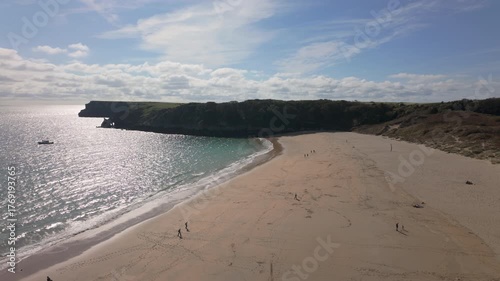 Summertime establishing shot of Barafundle Bay Beach on the Pembrokeshire coast, Wales.