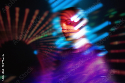 Surreal neon portrait with motion blur and cyberspace fantasy concept