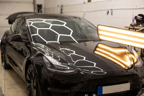 Black Auto Hail Damage Removal in Garage Workshop