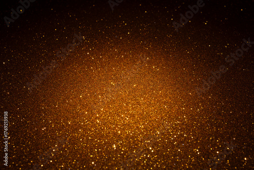 Wallpaper Mural Warm golden surface illuminated in the center reveals dense micro texture, sparkling particles spread outward like glowing embers fading into shadow Torontodigital.ca