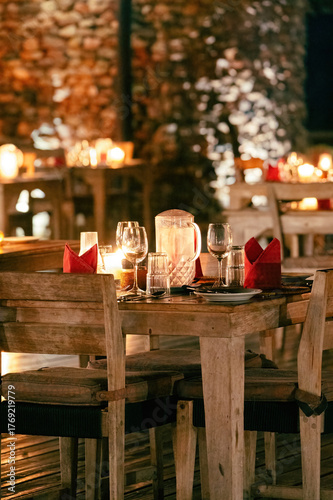 rustic table with ambient lights and crockery