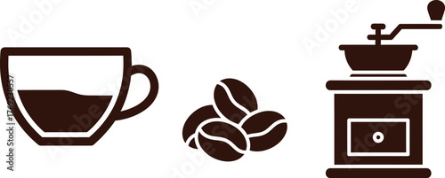 A cup of coffee, coffee beans, and a coffee grinder are shown.