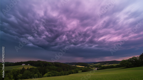 midgard. Dark purple storm clouds gathering before rainfall, dramatic sky formation, natural weather phenomenon. travel magazines, destination branding, designed for travel destination branding.