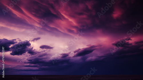 midgard. Dark purple storm clouds gathering before rainfall, dramatic sky formation, natural weather phenomenon. travel magazines, destination branding, designed for travel destination branding.