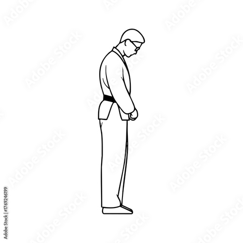 Martial arts instructor bowing respectfully, embodying discipline, humility, and traditional fighting spirit.
