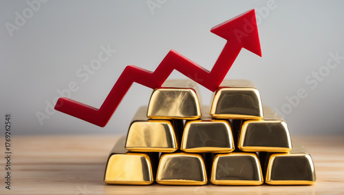 Financial success and wealth growth symbolized by gold bars and rising arrow.