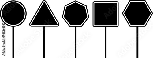 Collection of silhouetted traffic sign shapes on poles