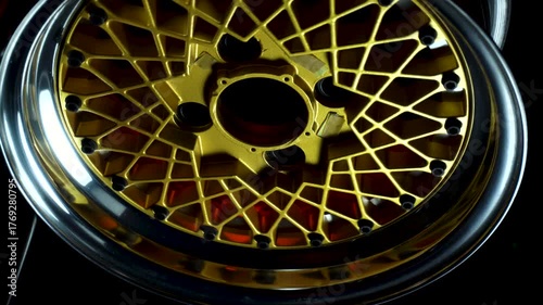 old retro stylish collapsible two-component wheels with a gold center and shiny rims for car tuning vertical video