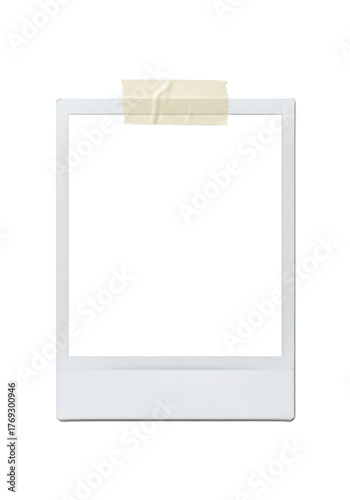 Blank square instant photo print frame taped to a surface with a single strip of masking tape isolated on a clean transparent background