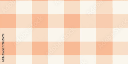 Soft peach and cream colored gingham plaid pattern seamless repeating textile background