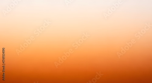 Gradient Sky in Orange Hue: A captivating gradient sky showcases a smooth transition of colors, beginning with a warm orange at the bottom and gradually fading to a lighter tone at the top.