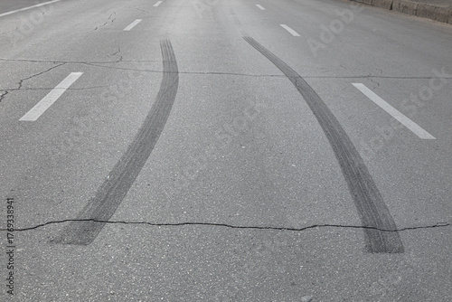 Black marks of burnt tires on asphalt after acceleration