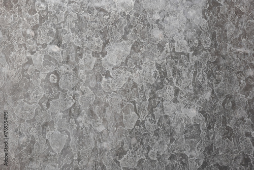 Hard water Calcium or lime scale deposit stains on a shower glass window. Close up, macro shot, no people