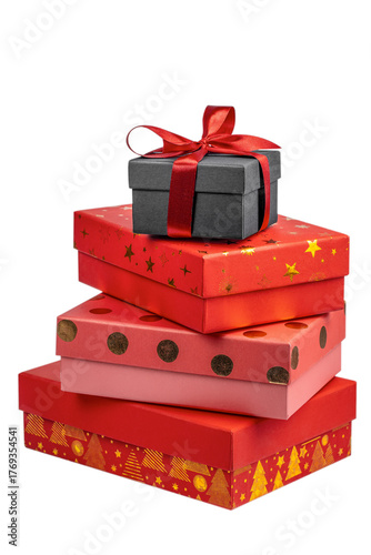 Stack of colorful gift boxes with Christmas decorations, including a black box tied with a red satin ribbon on top and red boxes with festive gold patterns and dots below, isolated on white