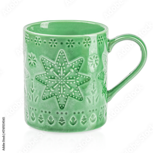 Green ceramic mug with embossed snowflake and decorative winter patterns, isolated on white background. Cozy Christmas or holiday-themed cup for hot drinks like coffee, tea, or cocoa