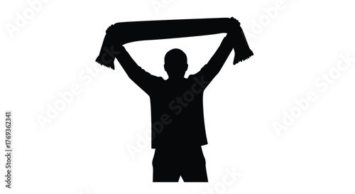 Silhouette of a person with arms raised holding a scarf overhead