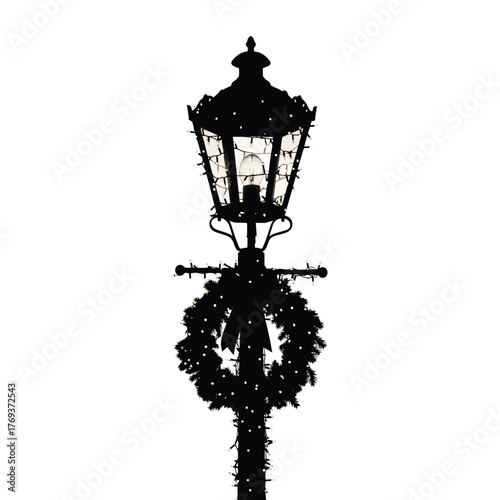 Ornate victorian lamp post decorated with a christmas wreath