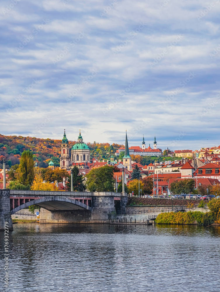 Obraz premium Prague Cityscape Autumn Panorama Vltava River Historic Bridges Church Architecture Fall Foliage Czech Republic European Travel Destination