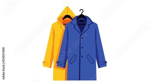 Two colorful raincoats hang on hangers against a white background.
