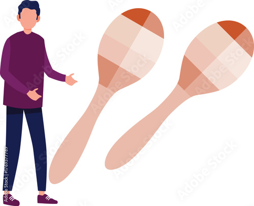 The boy is watching maracas