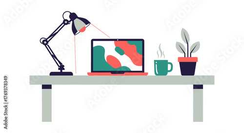 A modern desk setup features a laptop, desk lamp, plant, and a steaming mug of coffee.