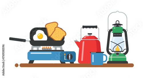 A camping stove with a frying pan, toast, and eggs next to a kettle and lantern.