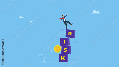 Businessman investor falling from stack block with word RISK impact by money coin. Investment risk, volatility and fluctuation in stock market that price will drop, stability and uncertainty.