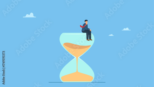 Thoughtful businessman hand on his chin sitting on sandglass think wisely. Thinker businessman thinking about business solution, creativity to solve problem or decision making.