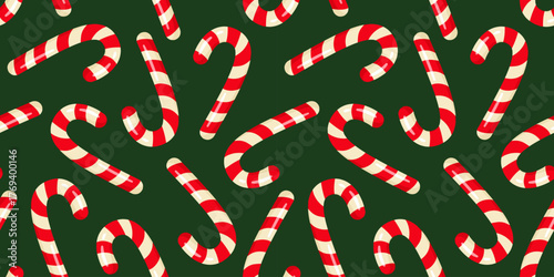 Candy Canes on green background. Merry Christmas and Happy New Year design for wrapping paper, packaging, wallpaper, textile, fabric, notebook, greeting cards