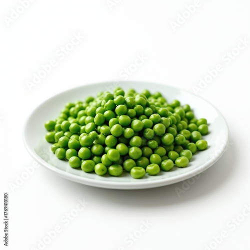 Pile of fresh green peas sits on a clean white plate. Simple food photo shows natural raw ingredient on white background. Healthy legume portion offers simple nourishment.