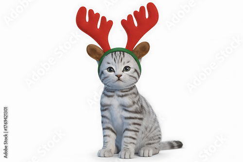 Festive kitten playfully dons reindeer antlers and a green headband, celebrating holiday cheer.