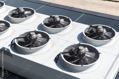 Industrial hvac system with large cooling fans on rooftop unit