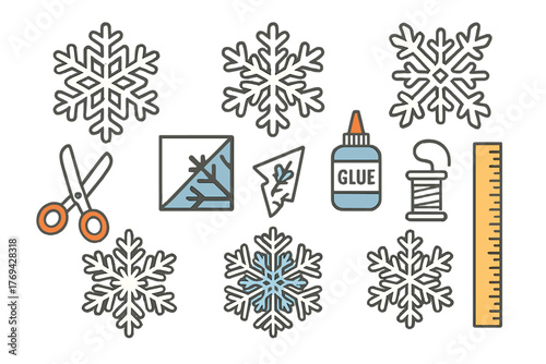 Winter craft supplies and handmade paper snowflakes for holiday DIY projects