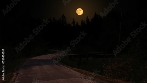 Moonlit bridge over a winding road at night with a full moon in the sky