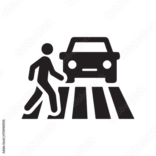 Pedestrian crossing a street safely at a marked crosswalk with an approaching vehicle