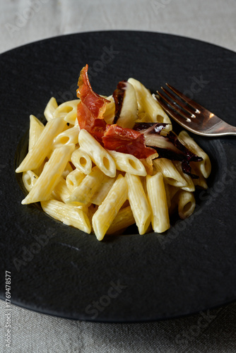 Penne al Gorgonzola Pasta with Creamy Blue Cheese Sauce garnished with Prosciutto Ham and Radicchio