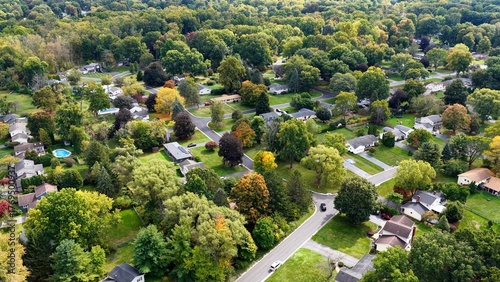 Typical rural neighborhood homes and streets living in up state New York, Fairport with green trees and grass lawns